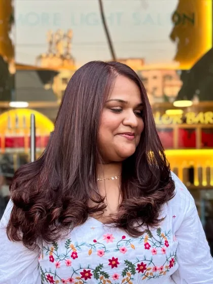 This client's mahogany hair looks radiant and healthy, with the babylights adding just the right amount of sparkle.
