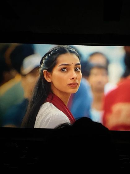 This is a close-up of my character from 'Dange/Por' as seen on the big screen. It captures a moment of vulnerability and concern, which was central to her journey.