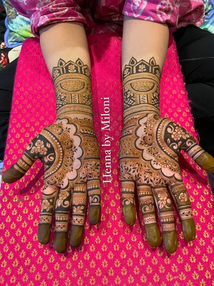 Both hands of the mandala and floral design, showing the perfect symmetry.