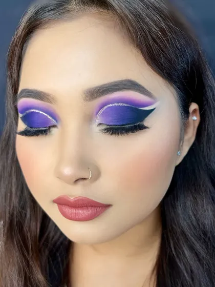 Letting the creative juices flow in my academy! I taught this graphic purple and white cut-crease look to help my students push their creative boundaries and learn to create versatile, artistic makeup.