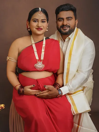 Blending love and tradition, this portrait captures a couple's shared heritage and their journey into parenthood, creating a culturally rich and deeply personal memory.