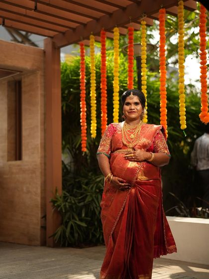My favourite client Shruthi at her Valaikaappu (baby shower). I draped her beautiful red silk saree to be comfortable and elegant, ensuring she felt special on her big day.