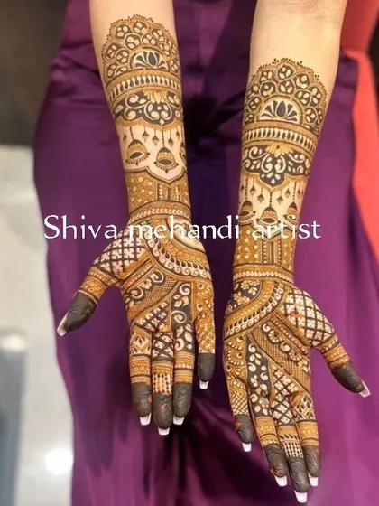An elegant design with a focus on symmetry and clean patterns. The dark-tipped fingers create a striking contrast with the detailed work on the hands and arms.