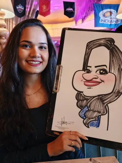 A smiling guest from the Coleda annual party. The vibrant atmosphere at 2BHK Diner & Keyclub was perfect for live art.
