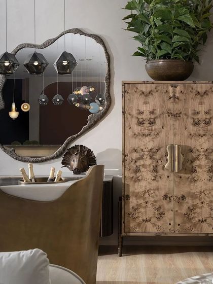 A detail from our India Design 2024 stall, featuring our Mapa Burl bar cabinet and the organic 'Soho Mirror'. This corner demonstrates our love for rich materials and creating beautifully curated moments.