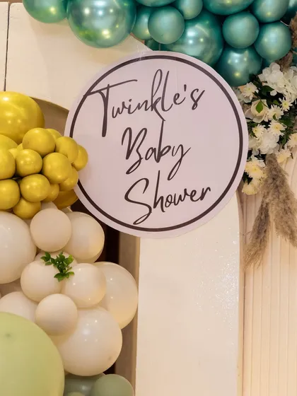 A close-up of the custom "Twinkle's Baby Shower" sign. I create personalized signage to match the theme and color scheme of your event, ensuring every detail is cohesive.