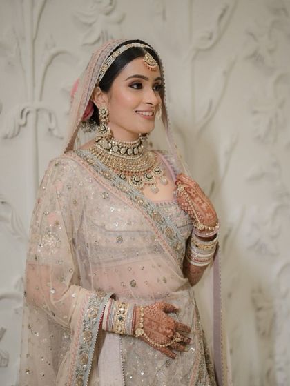 My bride Tanisha, looking like a dream in her pastel Anita Dongre lehenga. We created a soft, glowing makeup look to match the ethereal quality of her outfit.