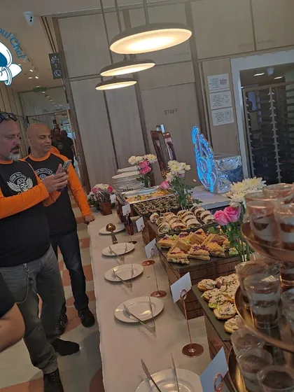Guests enjoying the hi-tea buffet at Dextrus Workspace. Seeing people connect and enjoy the food in a relaxed setting is what makes my work so fulfilling.