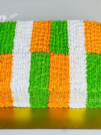 A cake to celebrate Republic Day. The frosting is piped to resemble the Indian tricolor flag, perfect for national holidays or celebrating new beginnings.