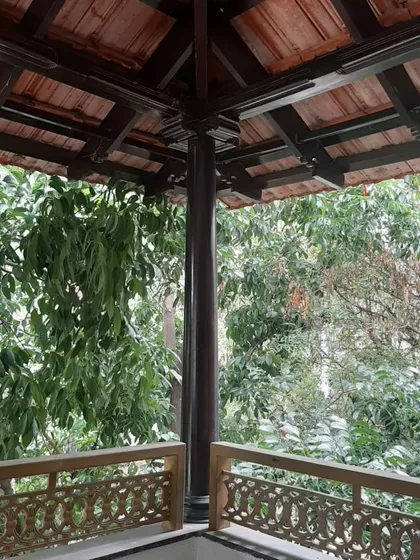 A detail from a heritage home restoration project. I worked to preserve the soul of the original structure, highlighting the beauty of the traditional terracotta tile roof and intricate wooden joinery, seamlessly connecting it to the surrounding greenery.