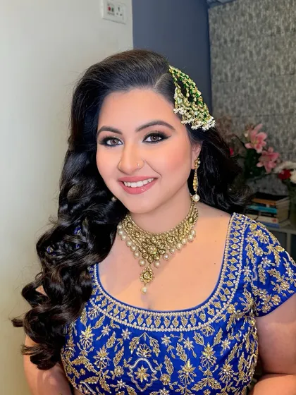 A closer look at Arushi's Sufi night glam. The gold shimmer on the eyes and the side-swept hair create a truly magical and celebratory feel.