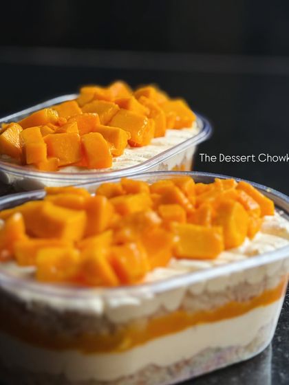 A close-up of my Mango Cake Tubs, filled with layers of cake, cream, and sweet mangoes. It's summer in a tub.