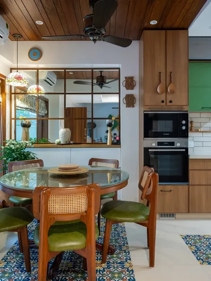 The internal window between the kitchen and dining room is a favorite detail of mine. It allows for interaction and shared moments, ensuring the person cooking is always part of the conversation.