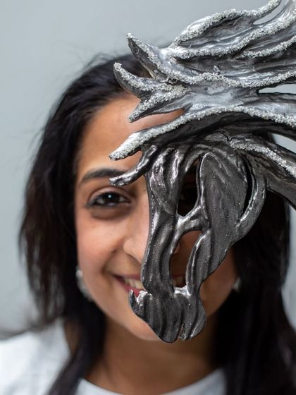 A playful and intimate shot with a horse sculpture, showing the connection I feel with each piece I create.