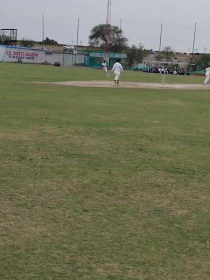 A view from the boundary during an ongoing match, showing the scale of our ground. Playing on a large field helps batsmen learn to find gaps and fielders to improve their ground coverage and throwing accuracy.