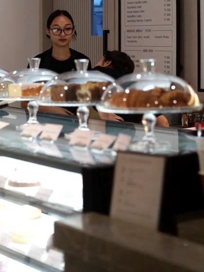 A look at our pastry counter, where our staff is ready to serve you with a smile. The glass cloches keep our bakes fresh.
