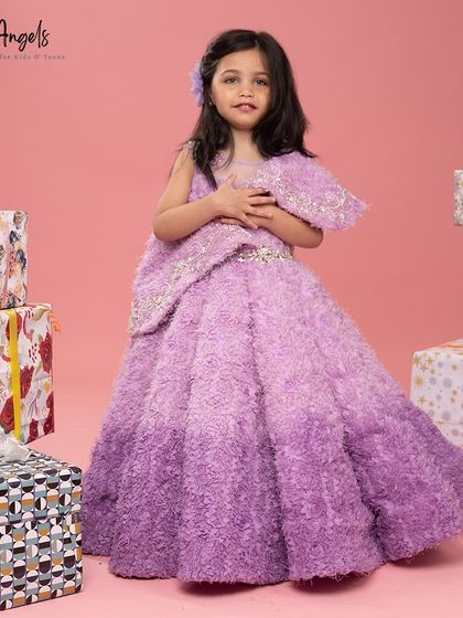 This ombre fur textured gown in shades of purple is a unique and cozy choice for a winter birthday.