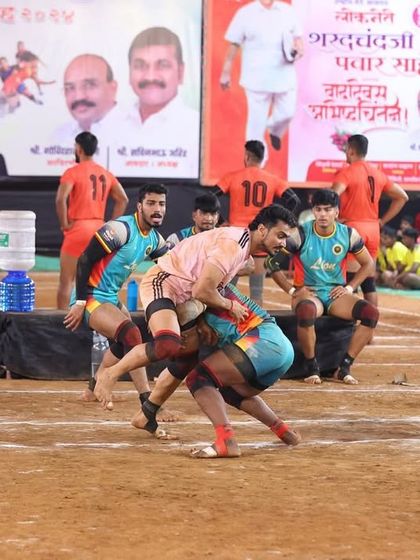 A raider caught in a powerful ankle hold, a fundamental defensive skill we teach all our players.