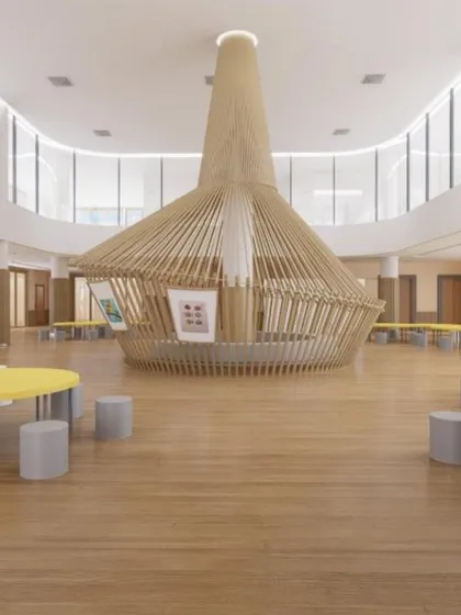 A concept render of a large, open-plan activity area in a school. The central wooden structure and surrounding tables create a dynamic hub for collaboration, play, and learning.