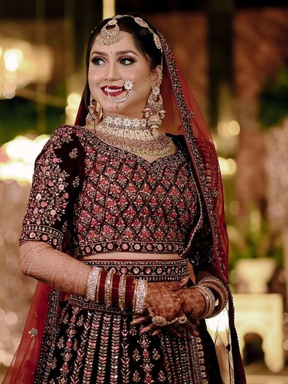 A candid portrait of the bride, capturing a moment of pure happiness. The soft lighting and her natural smile make this a beautiful and authentic shot.
