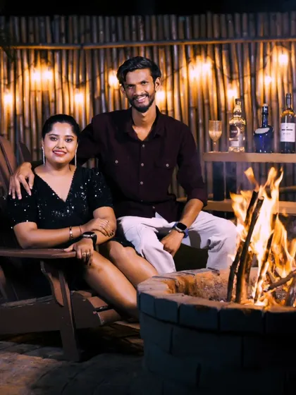 A relaxed and happy portrait of the couple enjoying the bonfire. Our packages are designed to be a stress-free and enjoyable experience.