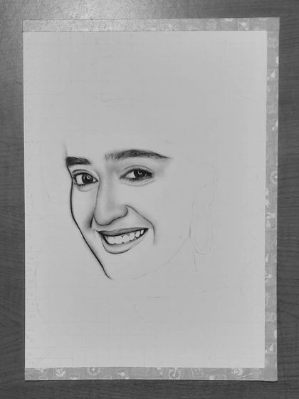 See how I drew Niharika NM's portrait. These images show the process from the initial grid and eye sketch to the final rendering of her hair and smile.