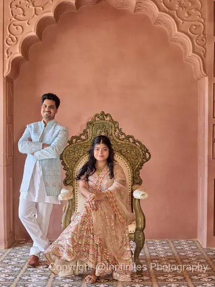 A formal portrait using our ornate throne, creating a look of classic royalty against the backdrop of our pink palace interior.