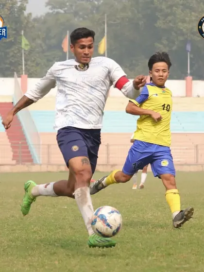 Our captain drives forward, leaving a defender behind with a burst of pace.