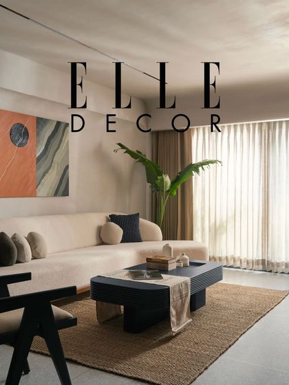 This living room, featured in Elle Decor, showcases a calm and private space with its ivory sofa and jute rug. The design proves that minimalist interiors can be warm, comfortable, and full of character.
