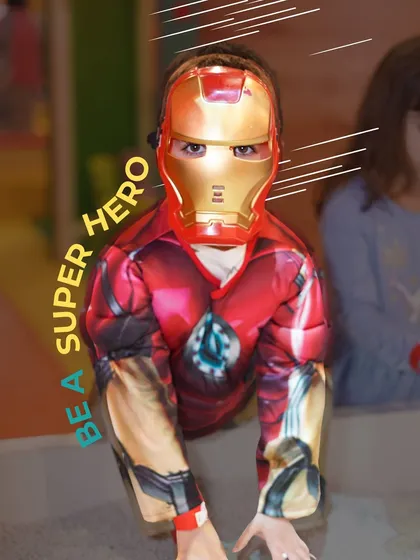 Our promise is to provide a space where kids can be anything they dream of. Here, a little guest lives out his superhero fantasy, dressed as Iron Man.
