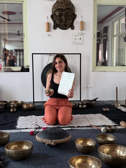 Here I am with my certification from the Himalayan Academy of Sound, surrounded by the tools of my practice. You can see the Tibetan bowls, mallets, and the large gong that all work together to create deep, healing vibrations for emotional release.