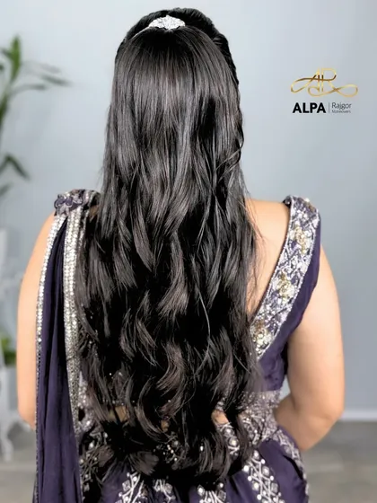 The sleek high ponytail, a chic and modern hairstyle for any party.
