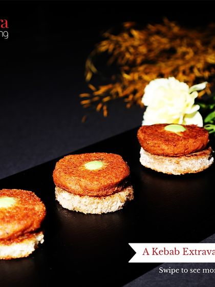 Mini kebab sliders served on a sleek black platter. These bite-sized treats are a modern and convenient way to enjoy the rich flavours of our kebabs.