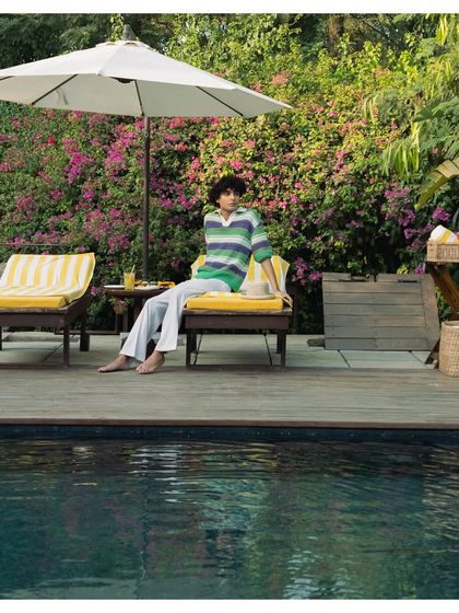 A duplicate of the guest relaxing, emphasizing the peaceful ambiance of our poolside.
