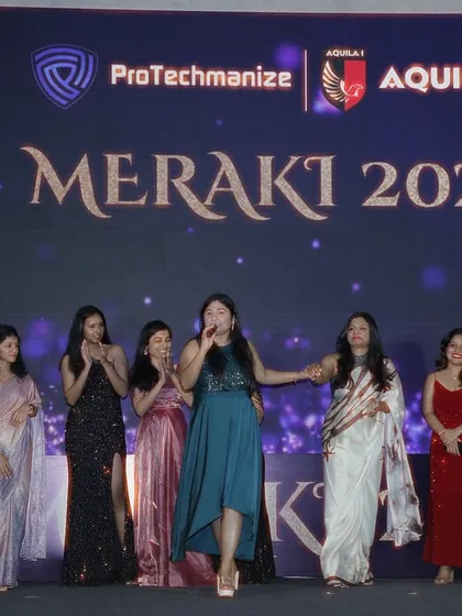 Interacting with the ladies on stage during a fun segment at the Meraki 2025 corporate event.