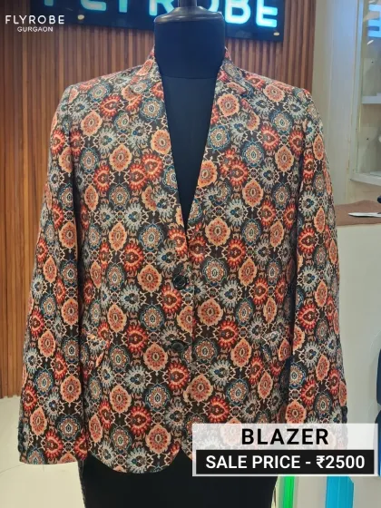 Show off your personality with this uniquely printed designer blazer. The intricate, colorful pattern makes it a standout piece for any celebration. It's available on clearance for just ₹2500, a small price for big style.