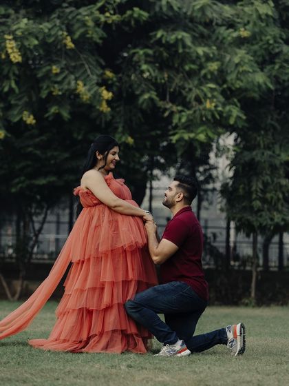 A romantic proposal moment during the maternity shoot. Our gown helps create fairytale-like pictures you'll cherish forever.