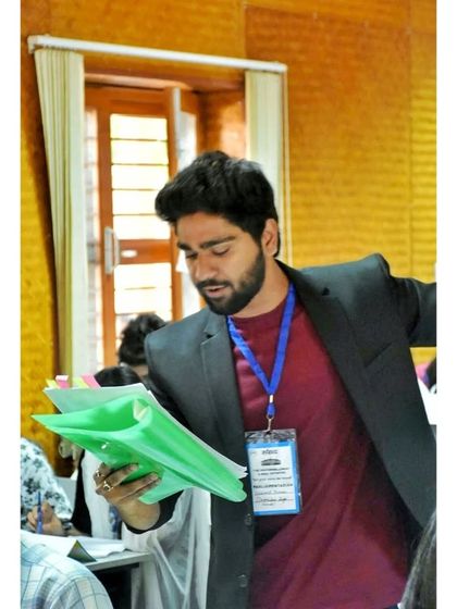 Reviewing case files. Even a lion must do his homework before the hunt.