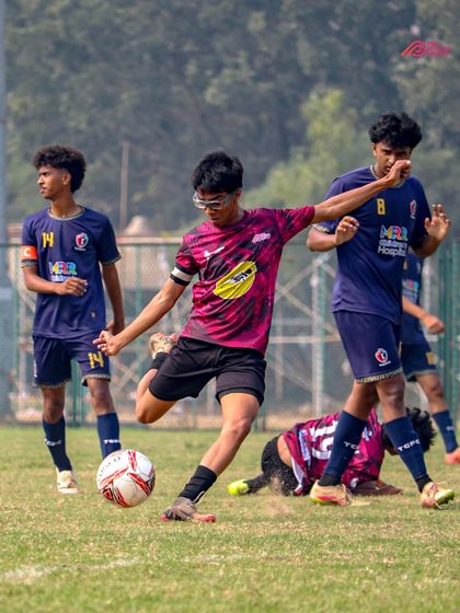 A powerful shot attempt during a Thane Youth League match, capturing the determination of our players.