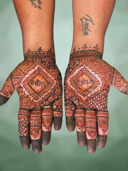 This design was created for the Jain observance of Varshitap Anumodana. The palms feature the sacred words "वर्षी तप" and "अनुमोदना" in Devanagari script, set within a clean, geometric pattern that is both beautiful and respectful.