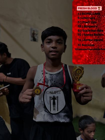 This young champion holds his medal and trophy from our "Fresh Blood" in-house competition. The workout list shows the tough challenge he overcame.
