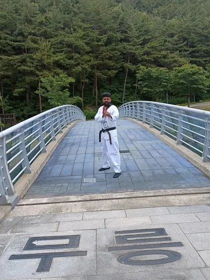 A respectful pose on the bridge at Muju.