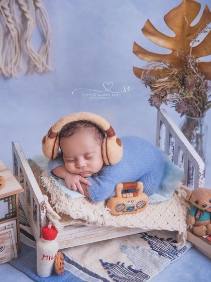 Listening to my favorite playlist. This little music lover is chilling in his tiny bed with headphones and a radio, a fun and modern theme.