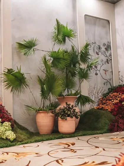 A corner of the 'Orchard of Life' setup, with earthen pots and lush greenery creating a natural and serene atmosphere.
