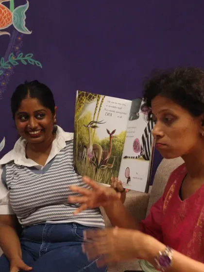 Two of our storytellers collaborate during a session, with one reading the book while the other uses expressive sign language. This teamwork ensures that every child, regardless of their abilities, can fully experience the magic of the story.
