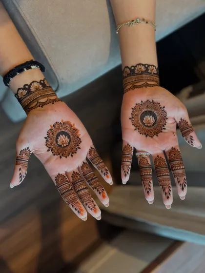 A minimal design with a simple lotus mandala on the palm.