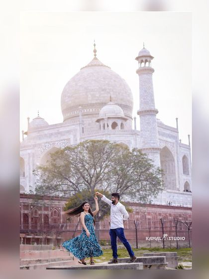 A dance of joy with the world's most famous monument to love. The movement in the dress and the happy expressions make this a dynamic and beautiful pre-wedding photograph.