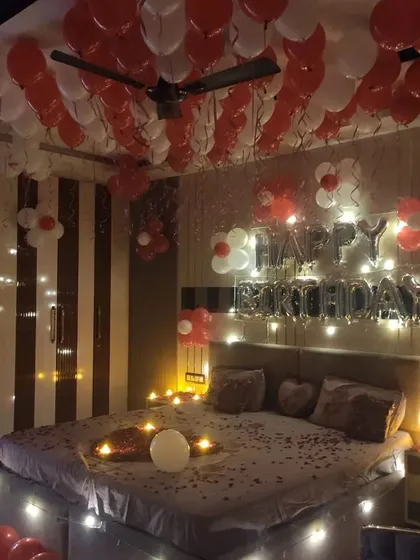 A full view of the decorated room, showing how our setup can completely transform a bedroom into a romantic celebration space.