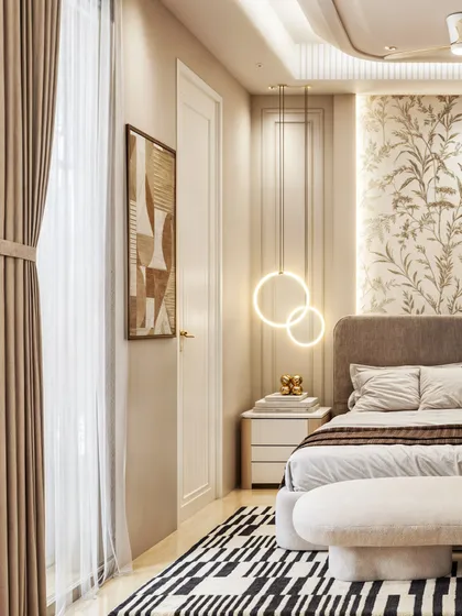 Another view of the bedroom, showing a bold black-and-white patterned rug that adds a graphic punch to the serene space.