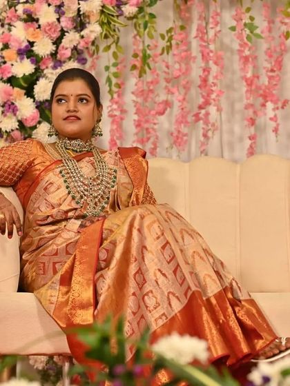 Sugandhi looking regal and relaxed during her reception. The focus was on clean, radiant skin and traditional jewelry to complement her stunning silk saree.